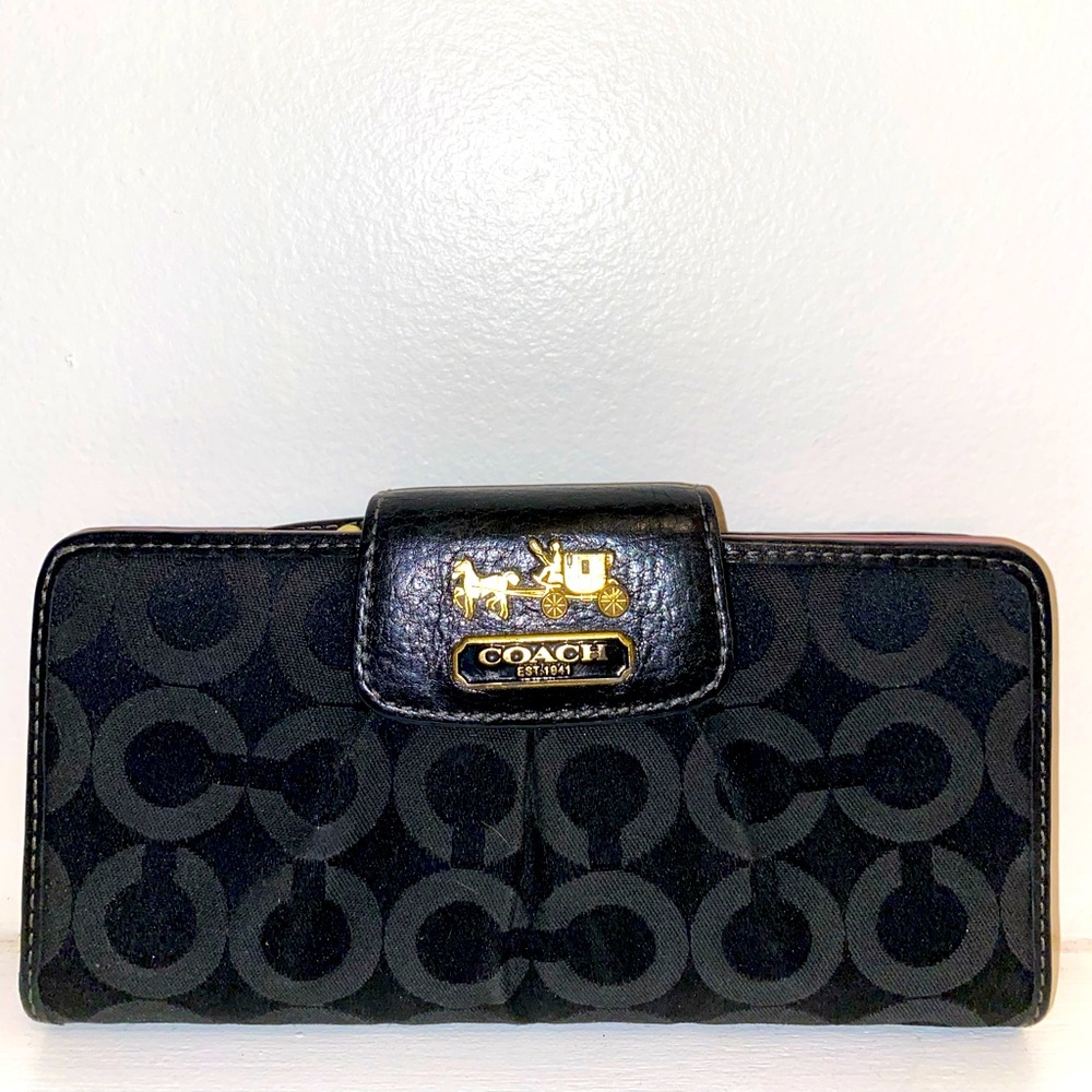 COACH clutch wallet with snap closure.  Approx 3x7.  Black and gold